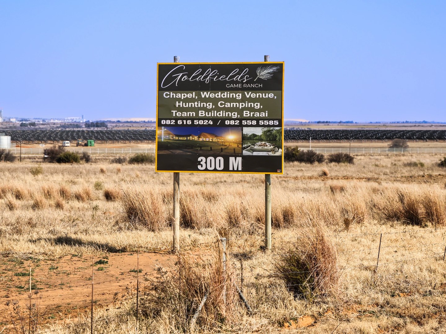 The Goldfields Game Ranch roadside sign standing in open Free State grassland beside the R730.