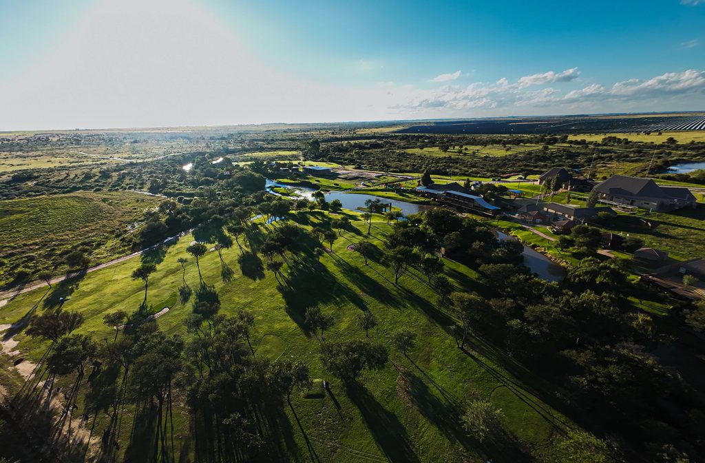 An aerial view over the Goldfields golf course, the river and the ranch buildings.